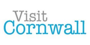 Visit Cornwall logo with the word 'Visit' in grey and 'Cornwall' in blue, both in a bold, rounded font on a white background.